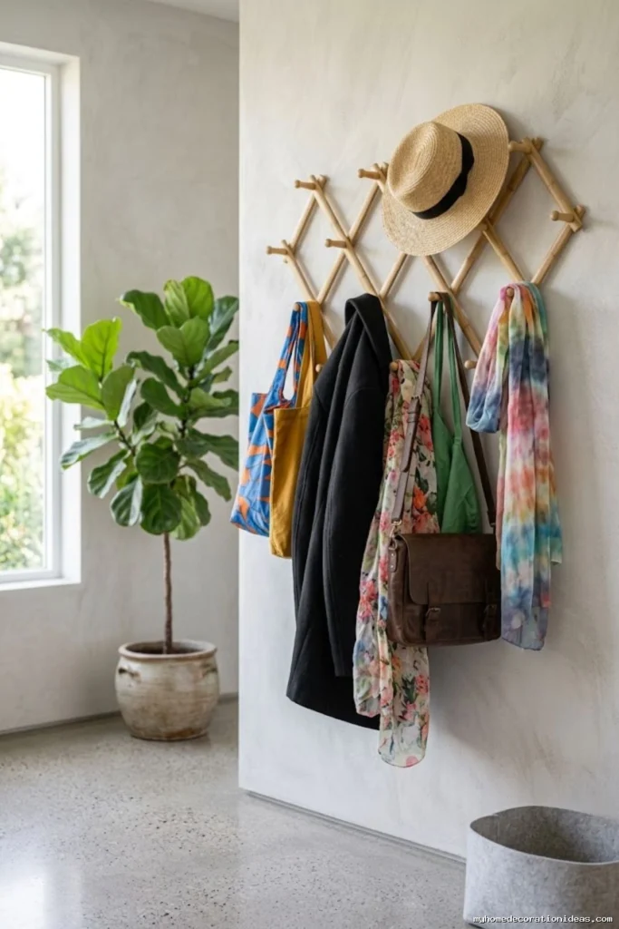 Expandable wall mounted bamboo accordion coat rack for small entryway space saving